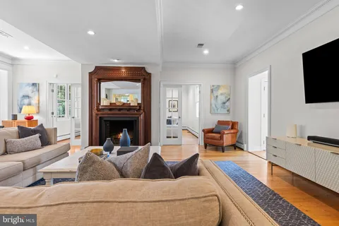 a spacious bedroom with a large bed and a window