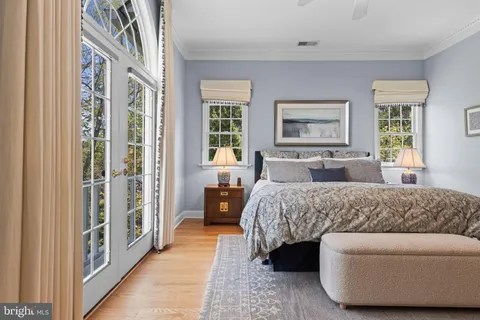 a bedroom with furniture and windows