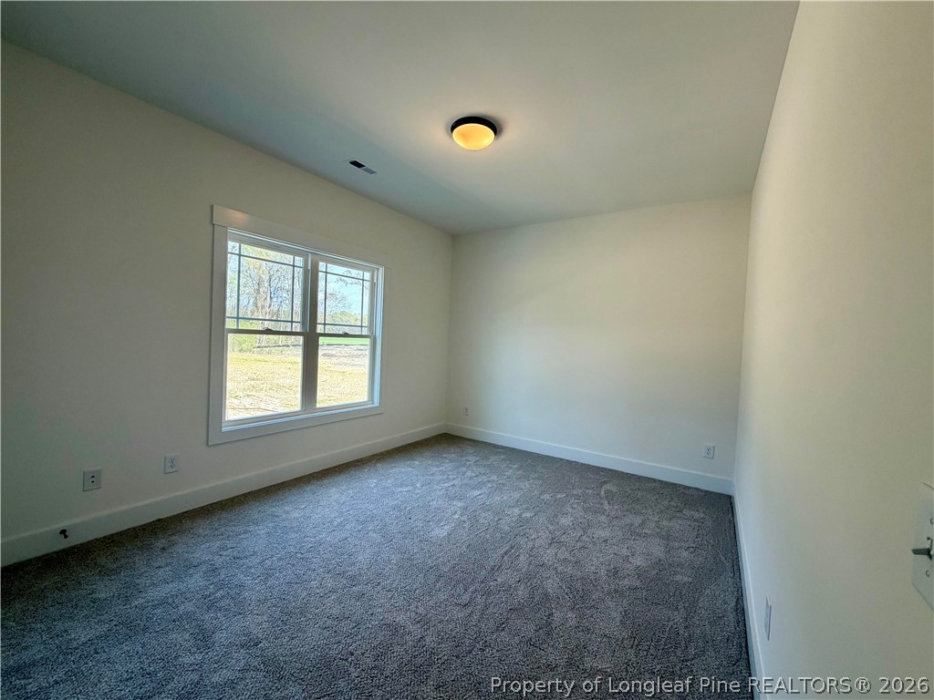 1788 Alderman Mill Road Dunn, NC 28334 - Photo 13 of 14 an empty room with a window