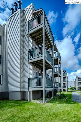 a view of city from balcony with seating space