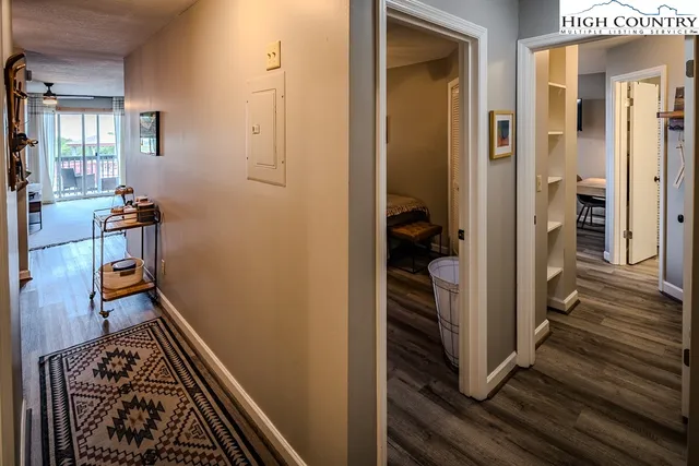 a view of a kitchen with stainless steel appliances granite countertop a sink and cabinets