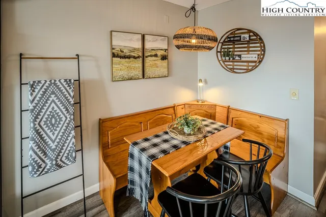 a view of a chairs and table in the balcony