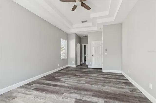 a kitchen with a refrigerator sink and cabinets