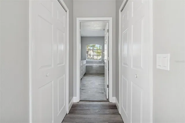 a kitchen with stainless steel appliances granite countertop a white stove top oven and white cabinets