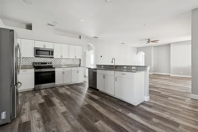 a view of room with window and hardwood floor