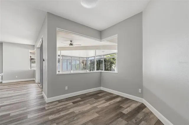 a kitchen with stainless steel appliances a refrigerator and a stove top oven