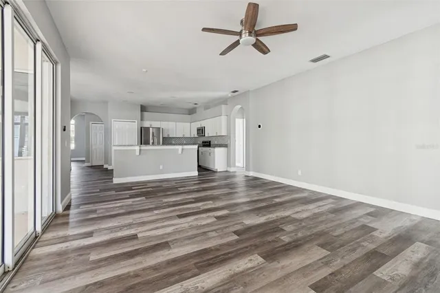 a view of a house with backyard and garden