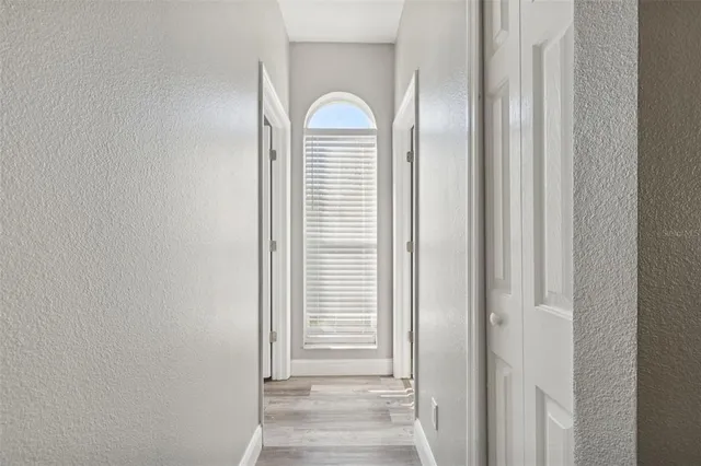 a front view of house with a garden