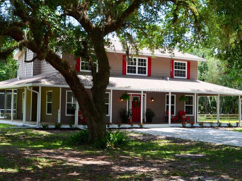 5017 Vanderipe Road Sarasota, FL 34241 - Photo 1 of 1 Exterior Front - What a great porch to relax on after a day in the saddle!