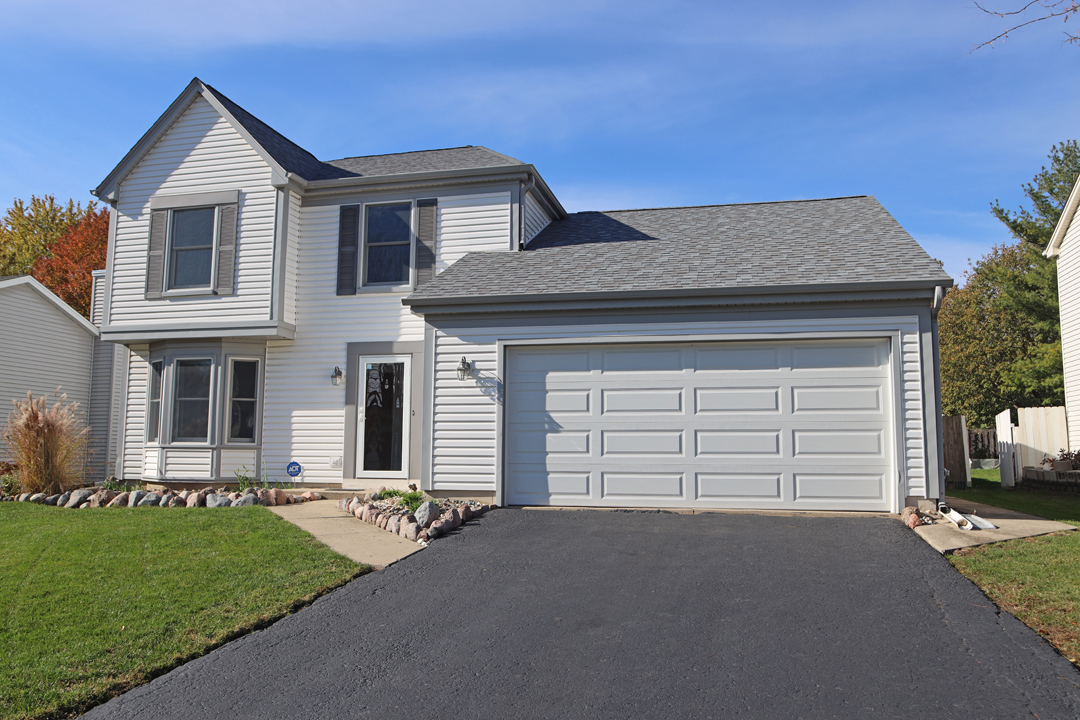 400 Barton Place Carol Stream, IL 60188 - Photo 1 of 45 a front view of a house with a yard and garage
