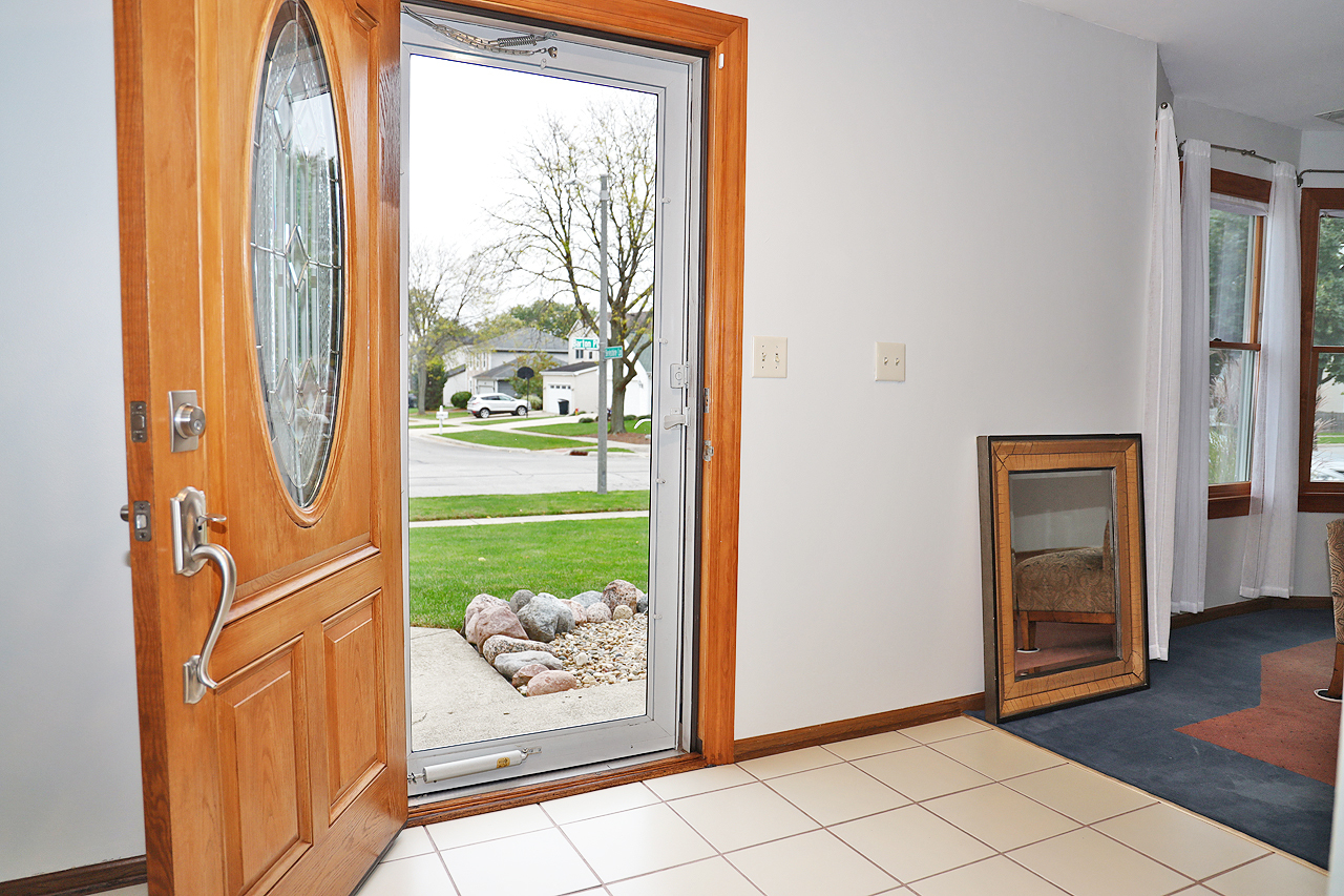 400 Barton Place Carol Stream, IL 60188 - Photo 3 of 45 a view of a door and wooden floor