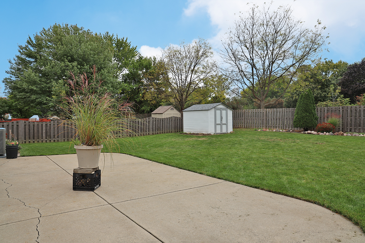 400 Barton Place Carol Stream, IL 60188 - Photo 39 of 45 a view of a house with backyard and a garden