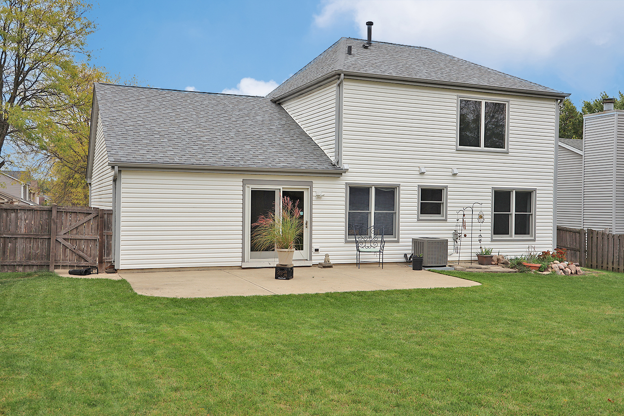 400 Barton Place Carol Stream, IL 60188 - Photo 43 of 45 a front view of house with a garden and patio