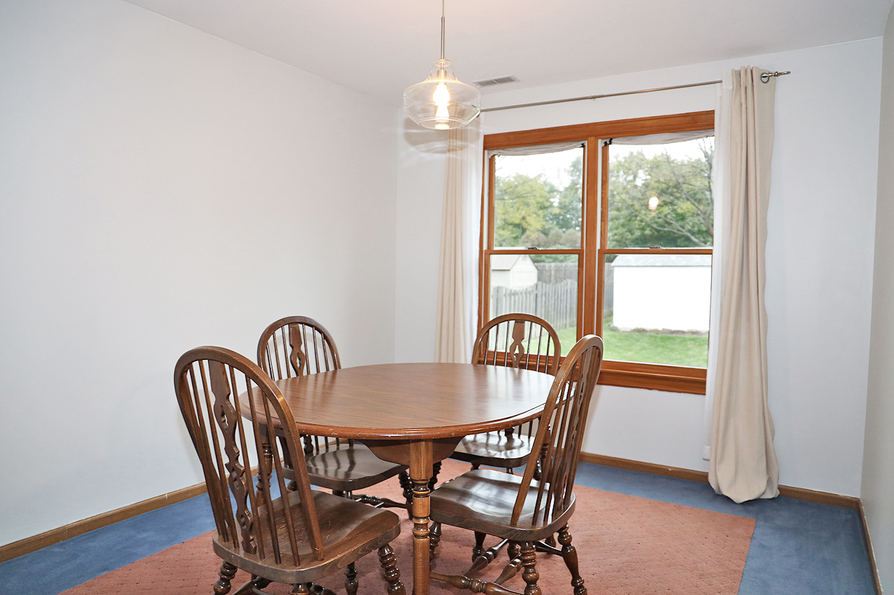400 Barton Place Carol Stream, IL 60188 - Photo 9 of 45 a dining room with furniture window wooden floor