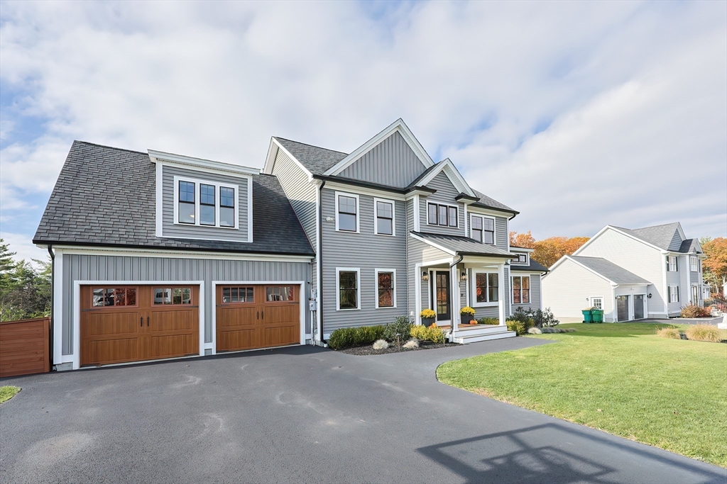 11 Lighthouse Lane Westminster, MA 01473 - Photo 41 of 42 a front view of a house with a yard and garage
