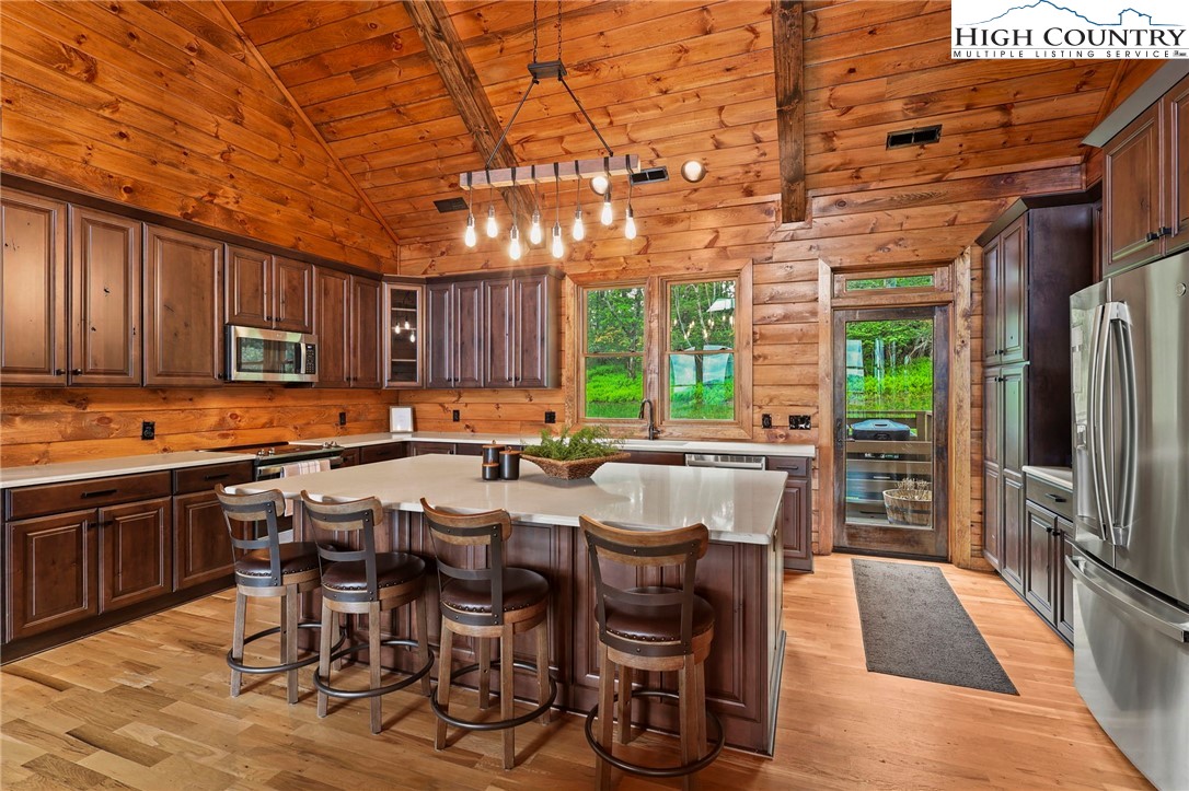 543 Broken Arrow Trail Boone, NC 28607 - Photo 11 of 46 a view of a dining room with furniture window and wooden floor