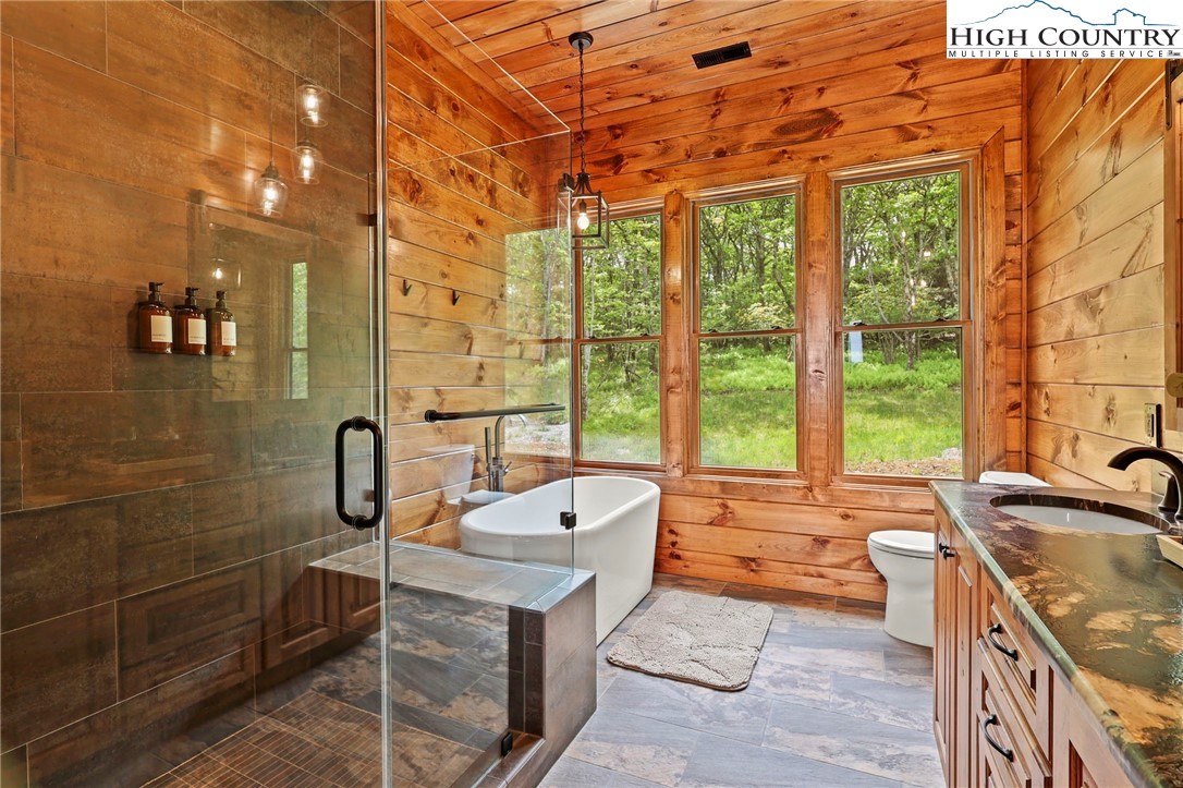 543 Broken Arrow Trail Boone, NC 28607 - Photo 17 of 46 a bath room with a sink and a bath tub