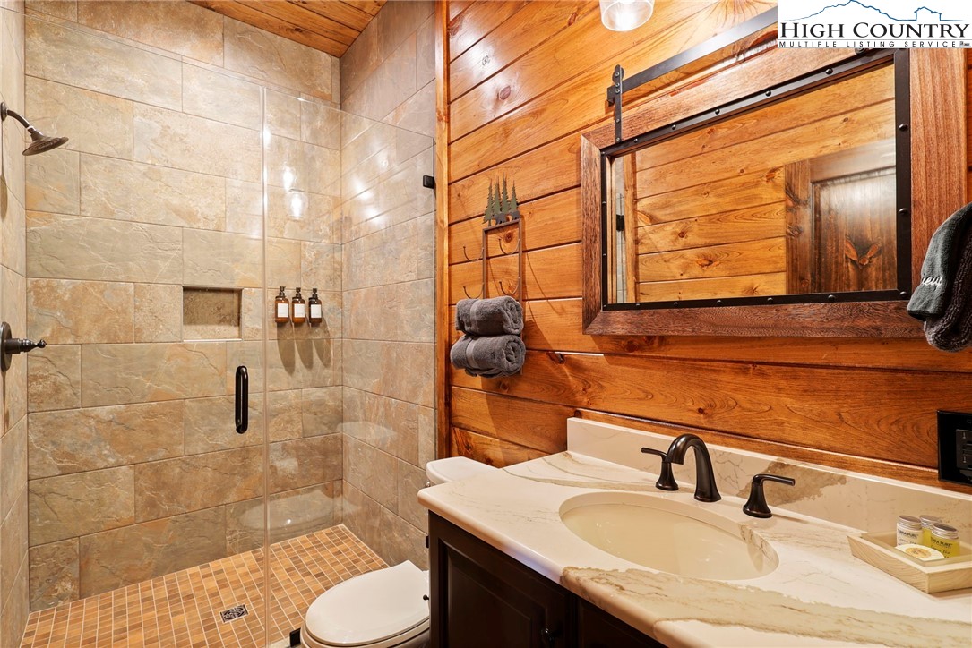 543 Broken Arrow Trail Boone, NC 28607 - Photo 24 of 46 a bathroom with a sink toilet and shower