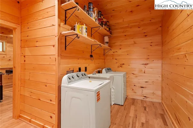 a view of a two chairs in the balcony