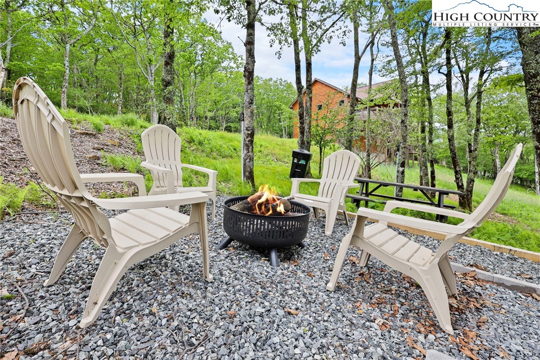 543 Broken Arrow Trail Boone, NC 28607 - Photo 35 of 46 a view of a chairs and table in the patio