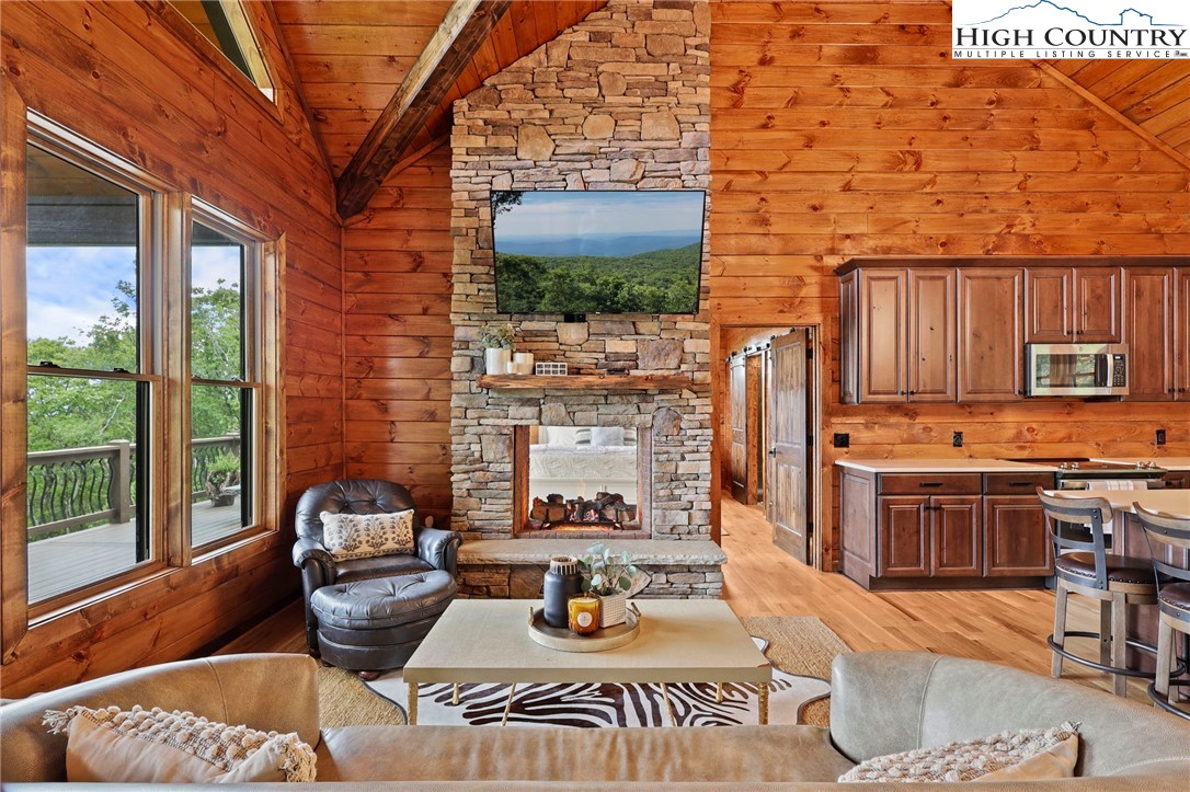 543 Broken Arrow Trail Boone, NC 28607 - Photo 4 of 46 a living room with furniture and a fireplace