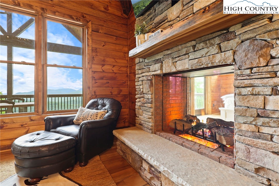 543 Broken Arrow Trail Boone, NC 28607 - Photo 7 of 46 a living room with furniture and a floor to ceiling window