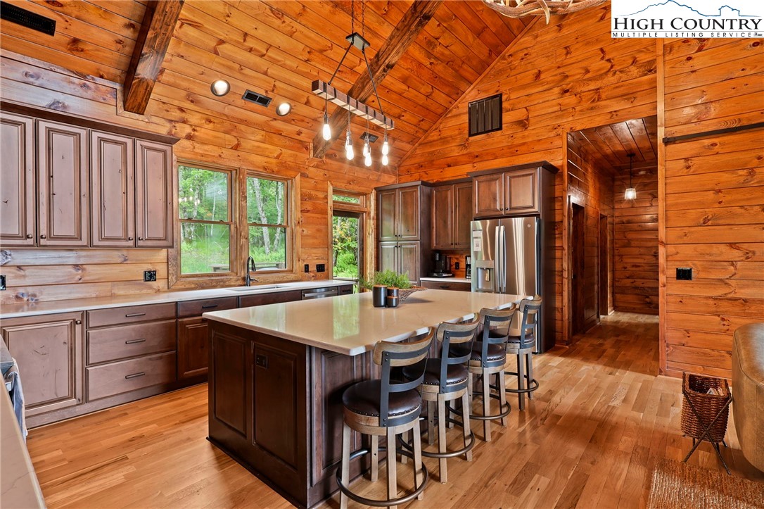 543 Broken Arrow Trail Boone, NC 28607 - Photo 10 of 46 a dining hall with stainless steel appliances granite countertop a sink and a refrigerator