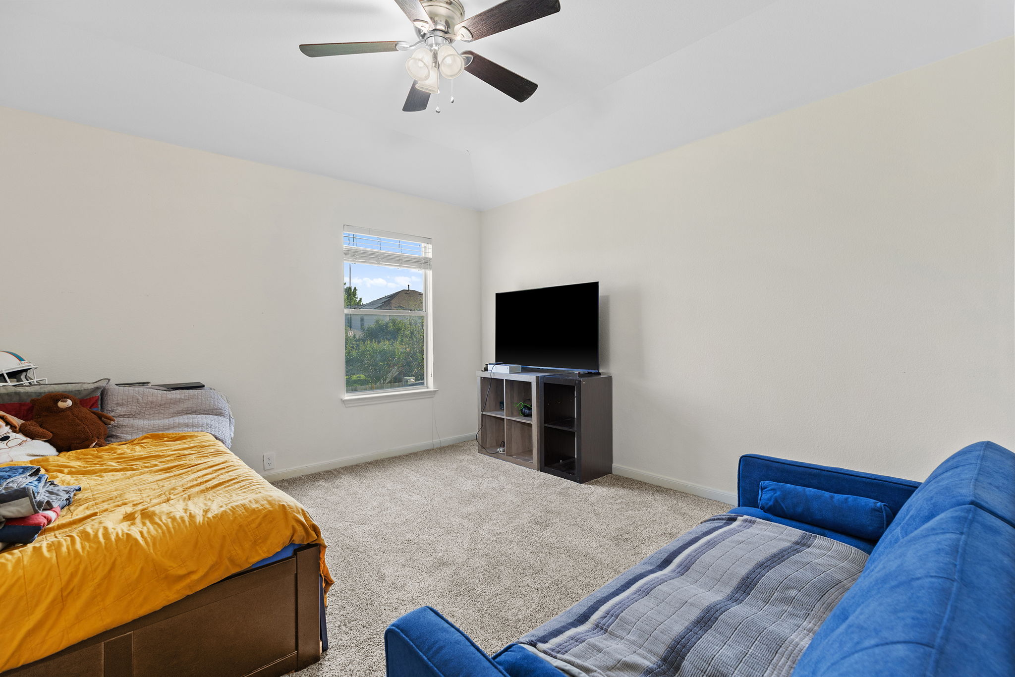 3517 Shiraz Loop Round Rock, TX 78665 - Photo 25 of 40 Carpeted room featuring a ceiling fan with integrated lighting, a single window, and light-toned walls