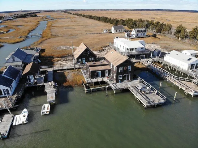 an aerial view of a house with roof deck