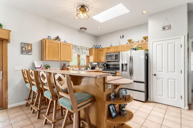 a view of a dining room with furniture and a chandelier
