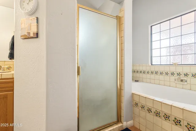 a bathroom with a bathtub and a sink