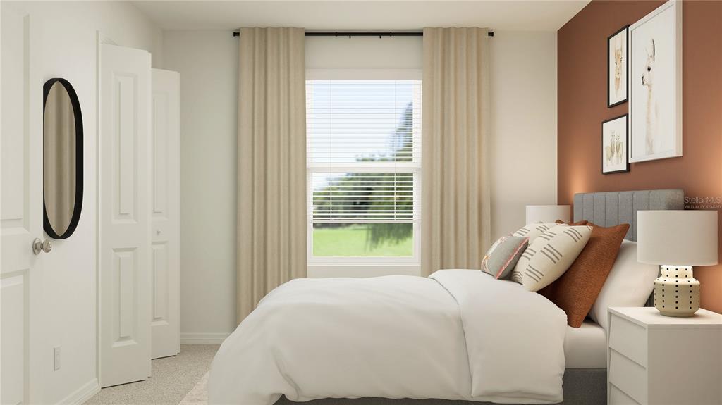 2422 Bluestone Road Haines City, FL 33844 - Photo 14 of 28 a bedroom with a bed and a window