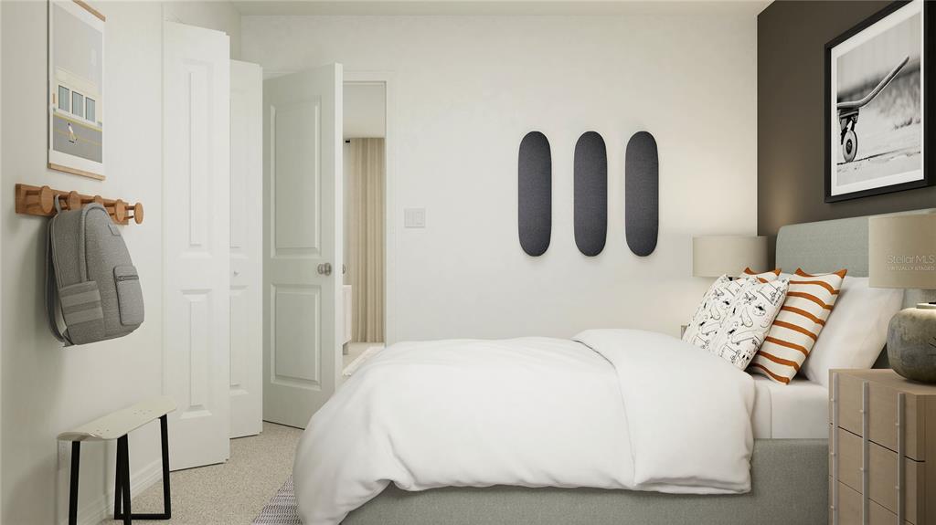 2422 Bluestone Road Haines City, FL 33844 - Photo 16 of 28 a bedroom with a bed and a wall painting