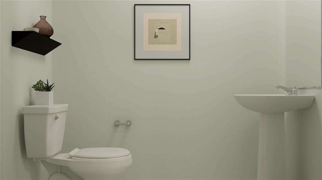 2422 Bluestone Road Haines City, FL 33844 - Photo 7 of 28 a bathroom with a toilet sink and mirror