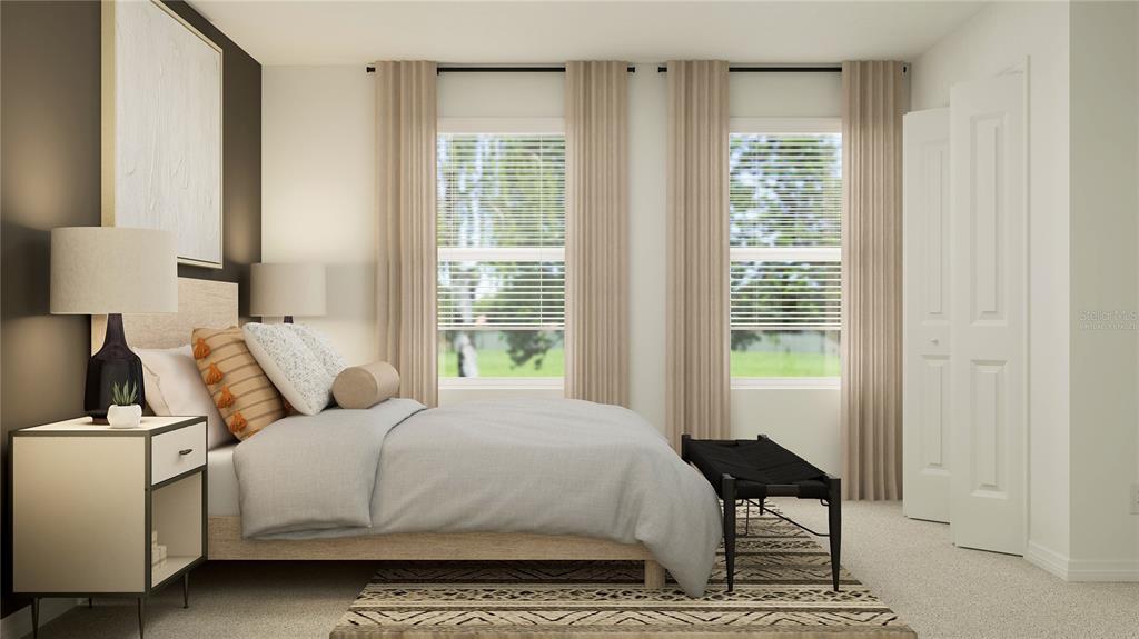 2422 Bluestone Road Haines City, FL 33844 - Photo 9 of 28 a bedroom with a bed and a window
