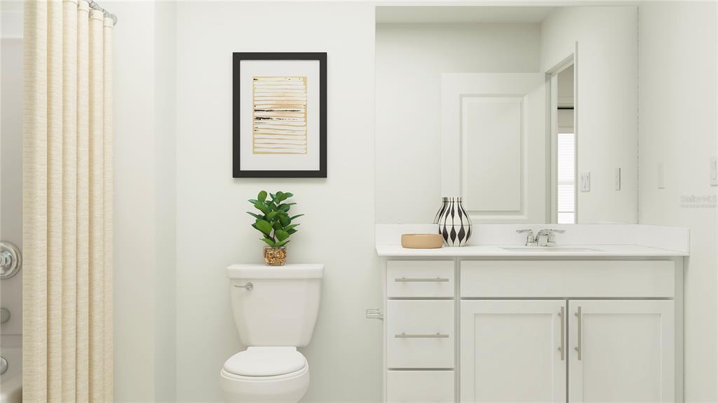2422 Bluestone Road Haines City, FL 33844 - Photo 10 of 28 a bathroom with a sink a toilet and a mirror