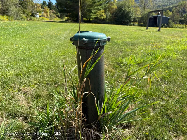 a view of a porch with furniture and garden