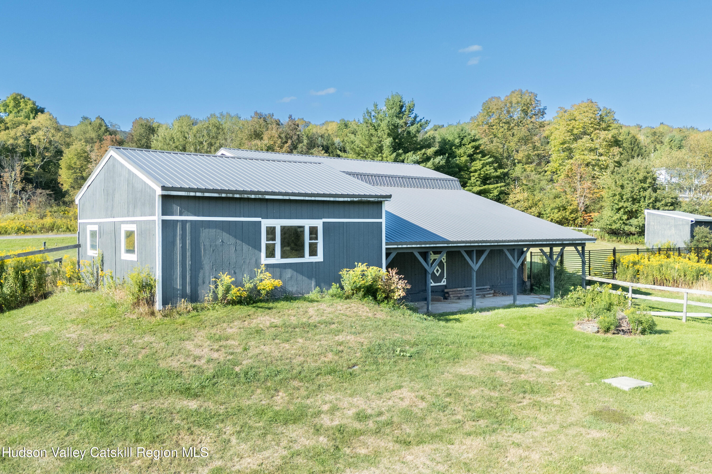 5574 County Highway Denver, NY 12421 - Photo 17 of 36 front view of a house with a yard