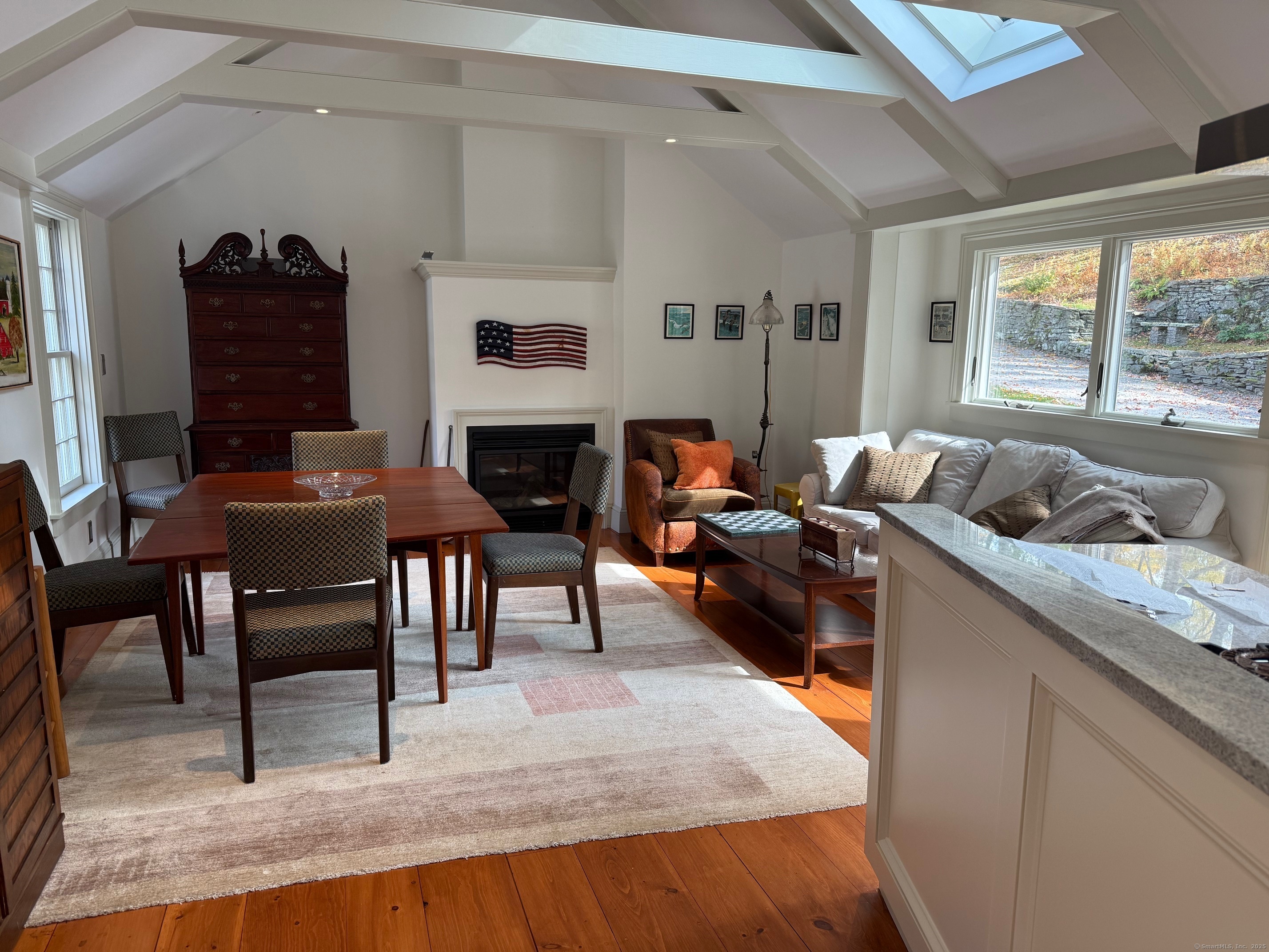 150 Ferry Road, Unit GATEHOUSE Lyme, CT 06371 - Photo 11 of 28 a living room with furniture and a fireplace
