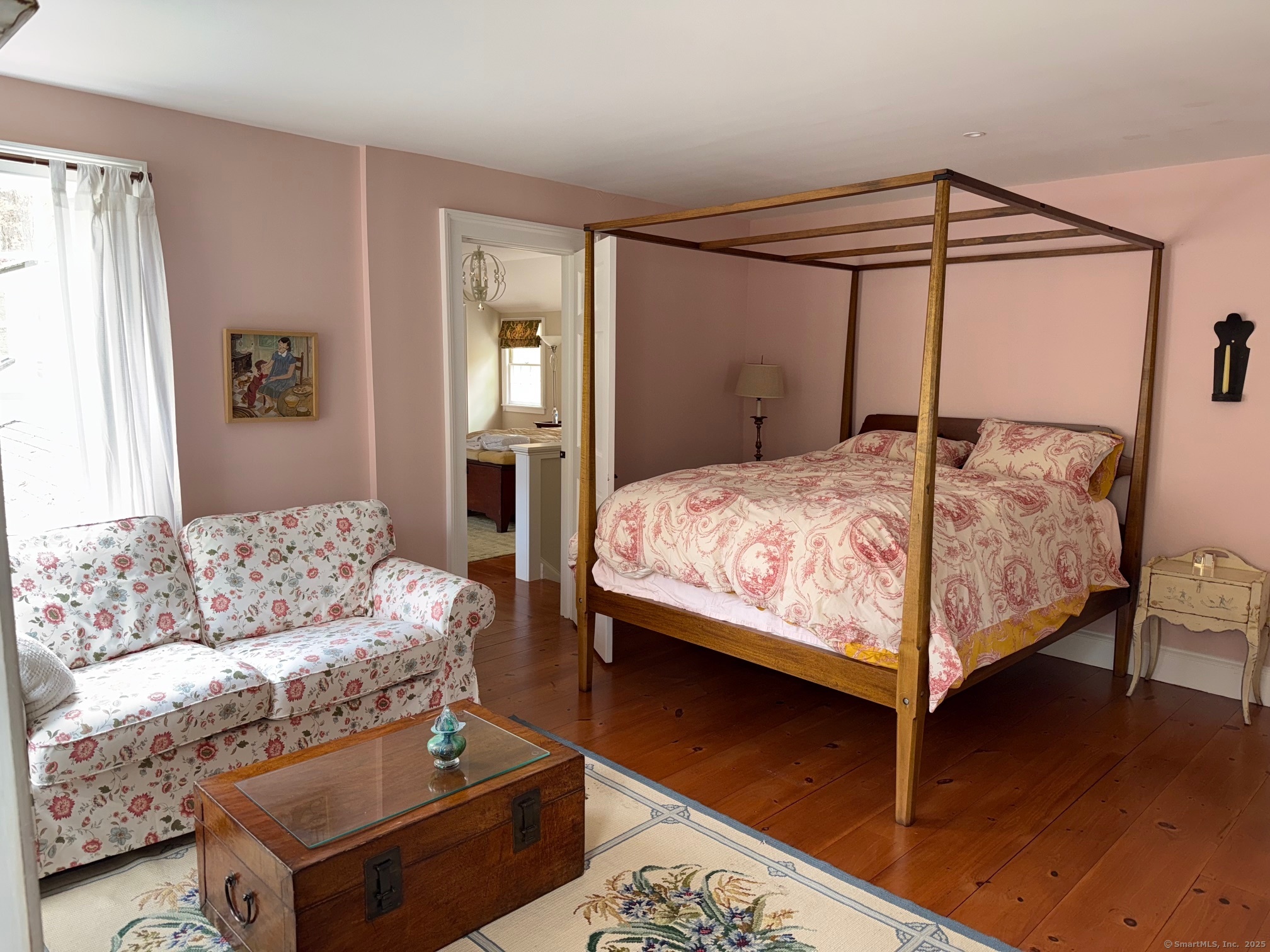 150 Ferry Road, Unit GATEHOUSE Lyme, CT 06371 - Photo 12 of 28 a bedroom with a bed couch and a window