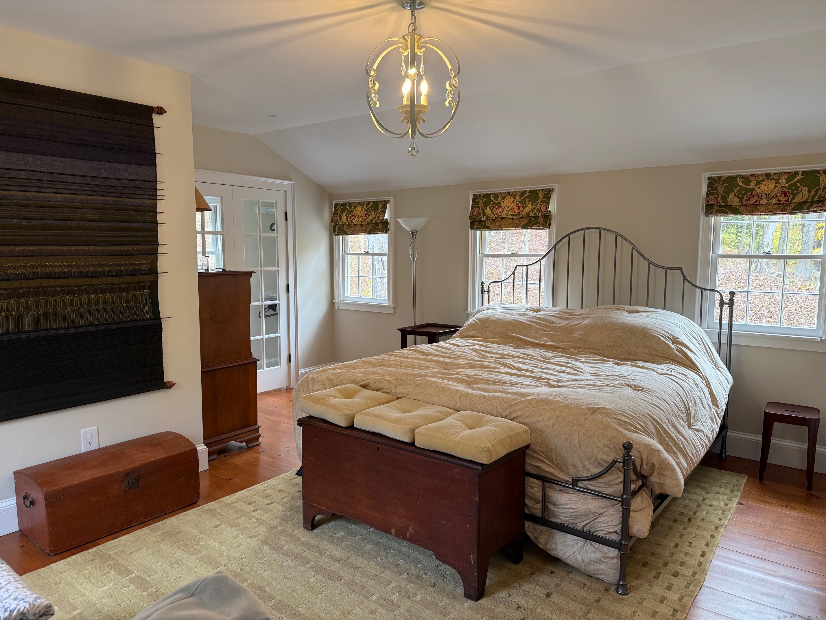 150 Ferry Road, Unit GATEHOUSE Lyme, CT 06371 - Photo 13 of 28 a spacious bedroom with a bed mirror and a window