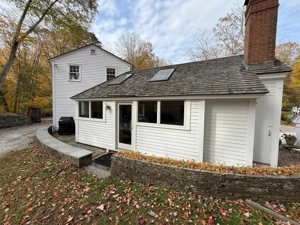 a view of a house with a yard and garage