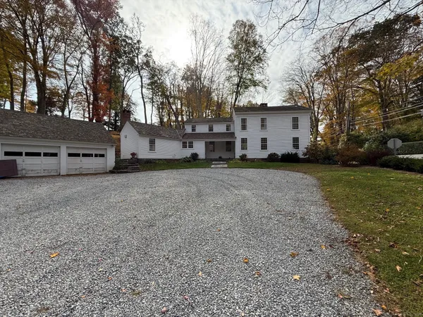 a view of a house with a back yard