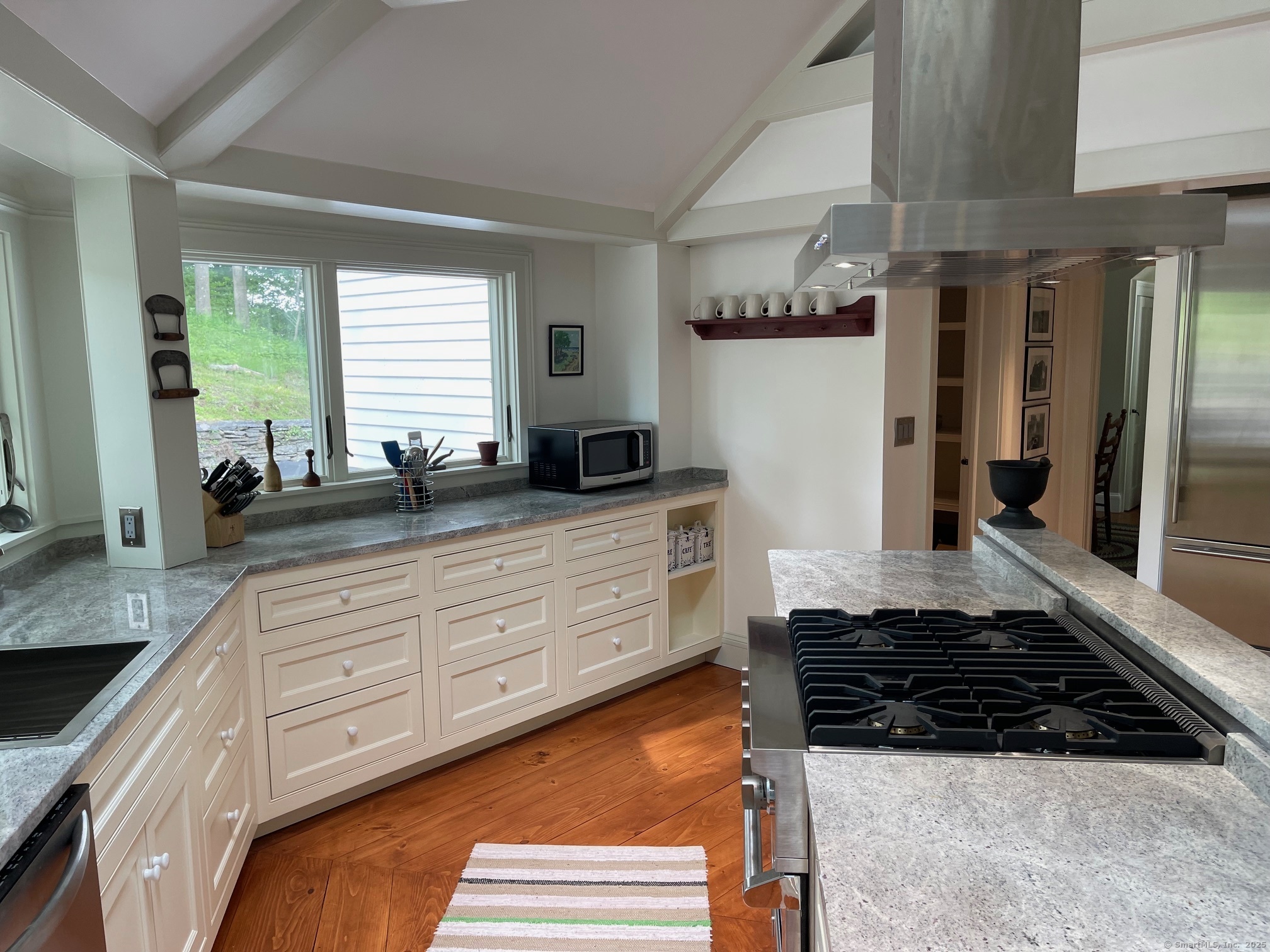150 Ferry Road, Unit GATEHOUSE Lyme, CT 06371 - Photo 21 of 28 a kitchen with stainless steel appliances granite countertop a sink stove and refrigerator