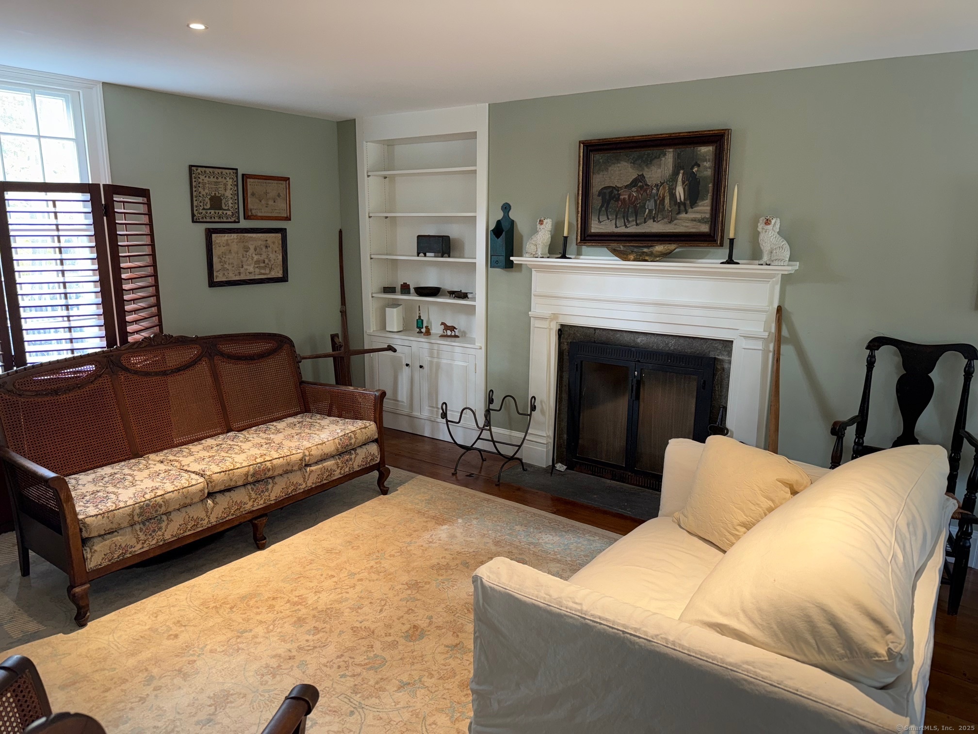 150 Ferry Road, Unit GATEHOUSE Lyme, CT 06371 - Photo 6 of 28 a living room with furniture and a fireplace