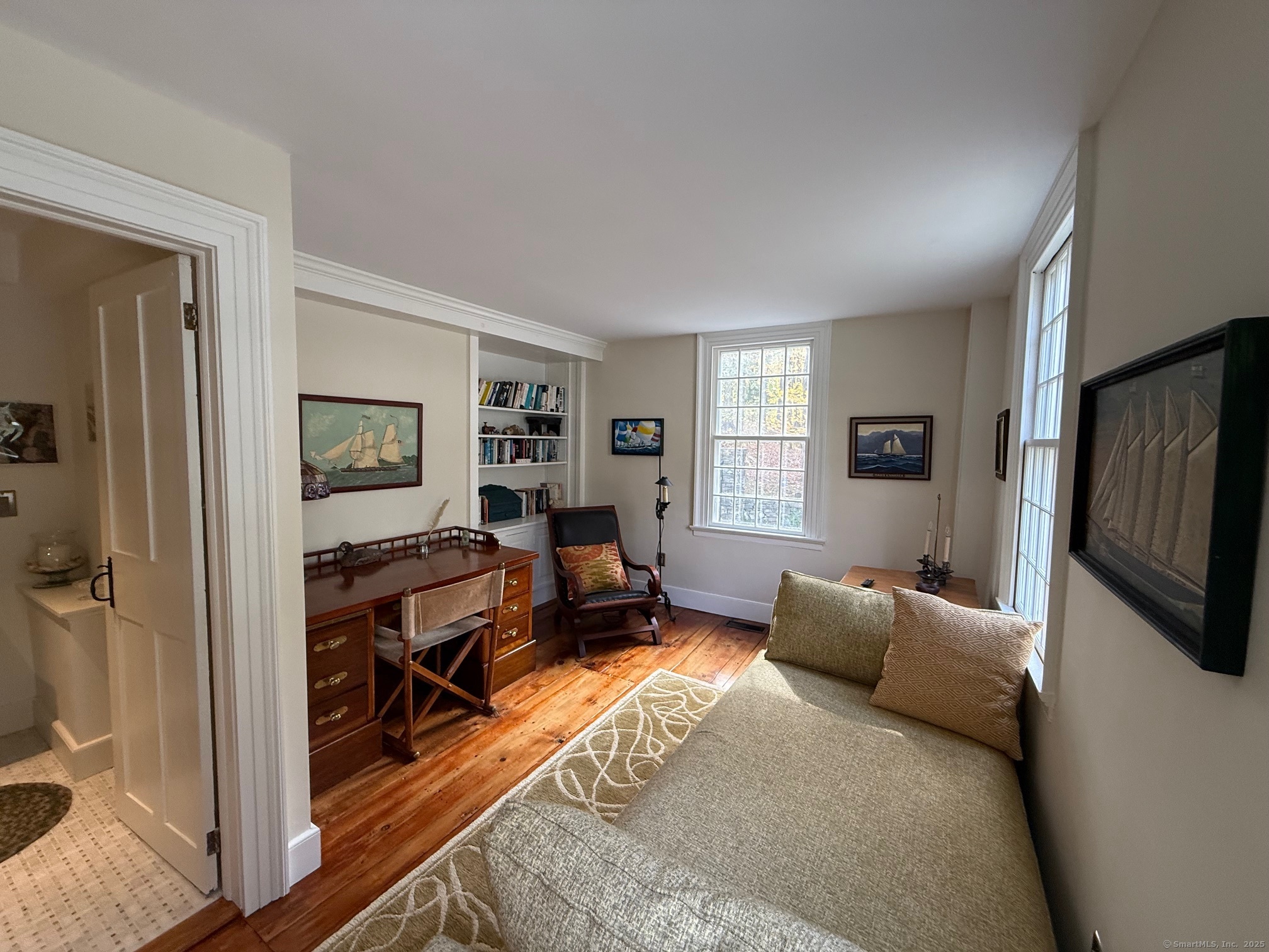 150 Ferry Road, Unit GATEHOUSE Lyme, CT 06371 - Photo 7 of 28 a bedroom with furniture and a flat screen tv