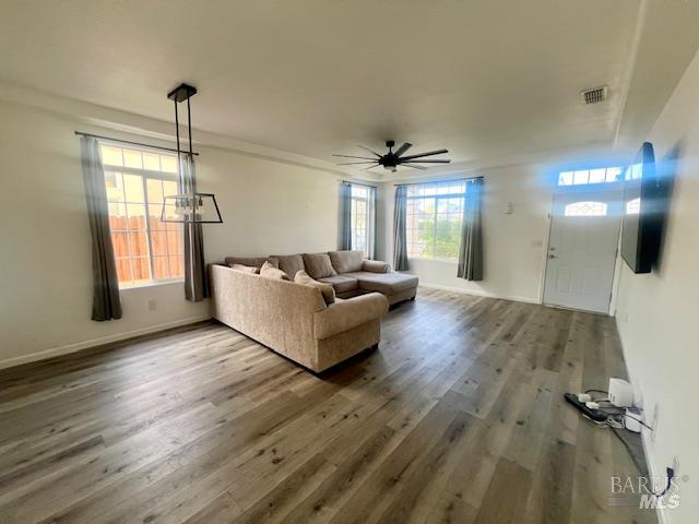 718 Allender Way Rio Vista, CA 94571 - Photo 5 of 25 a living room with furniture and a chandelier