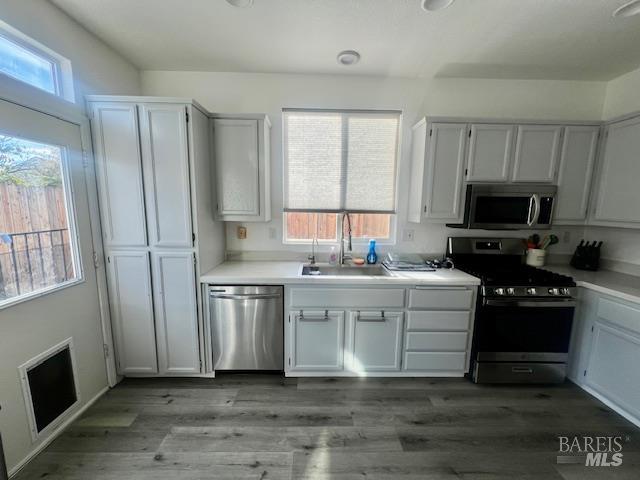 718 Allender Way Rio Vista, CA 94571 - Photo 6 of 25 a kitchen with a sink stove and microwave
