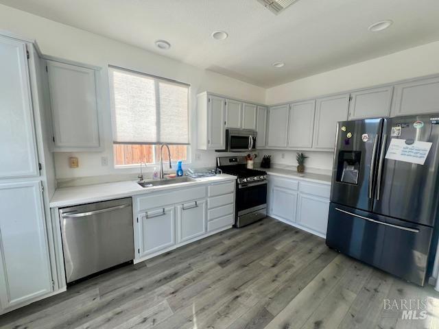 718 Allender Way Rio Vista, CA 94571 - Photo 7 of 25 a kitchen with a refrigerator stove microwave and sink