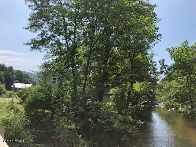 25 Sandisfield Road Sandisfield, MA 01255 - Photo 2 of 32 a view of a lake with a tree